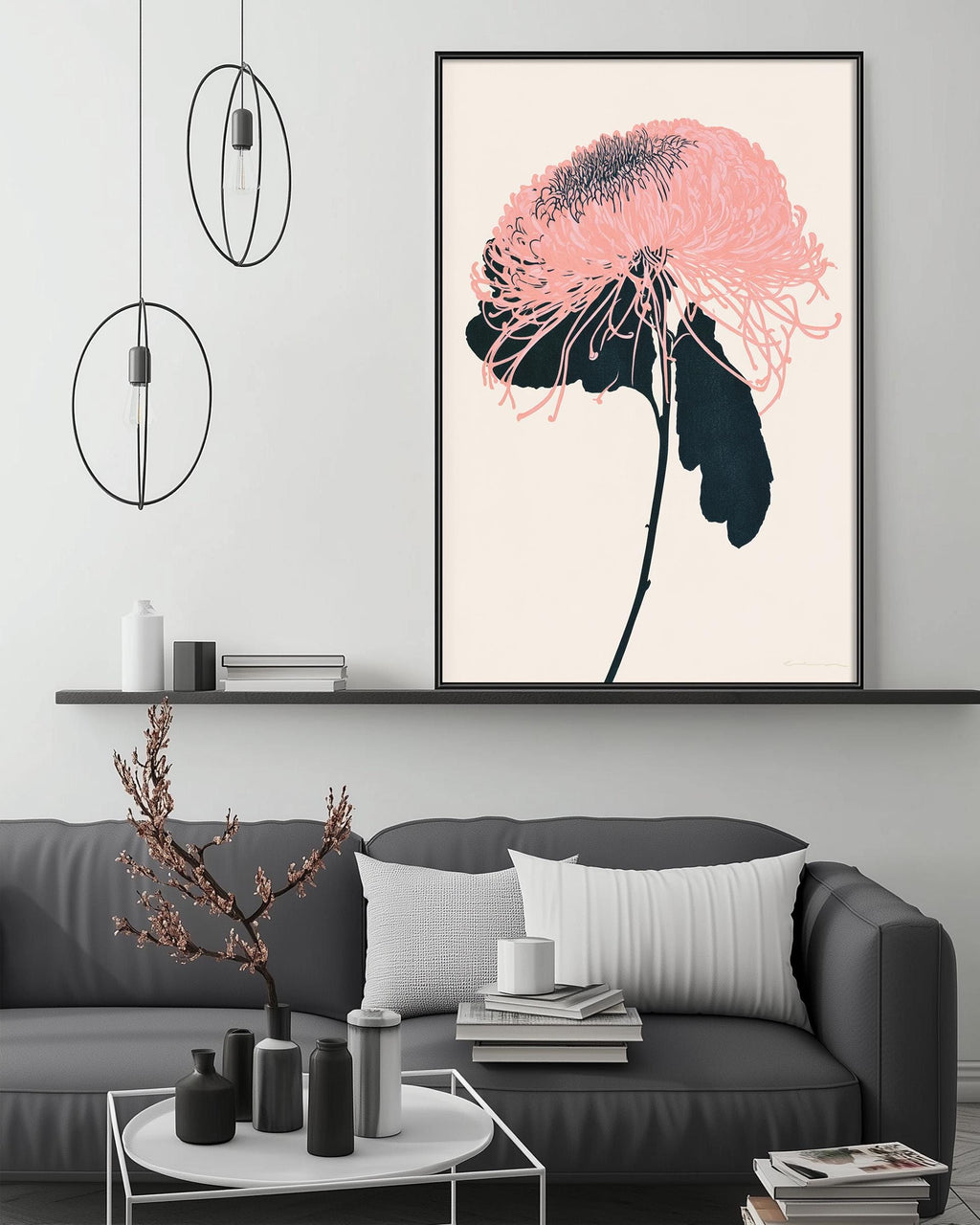 a modern living room with a gray sofa, a coffee table, and a large framed artwork of a pink flower on the wall.