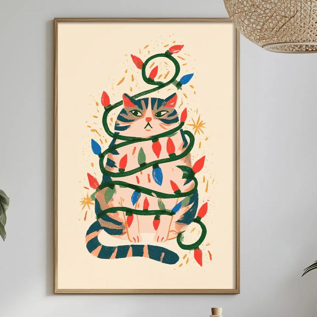 a framed illustration of a cat wrapped in Christmas lights, hanging on a wall above a dining table with various decorative items and plants.