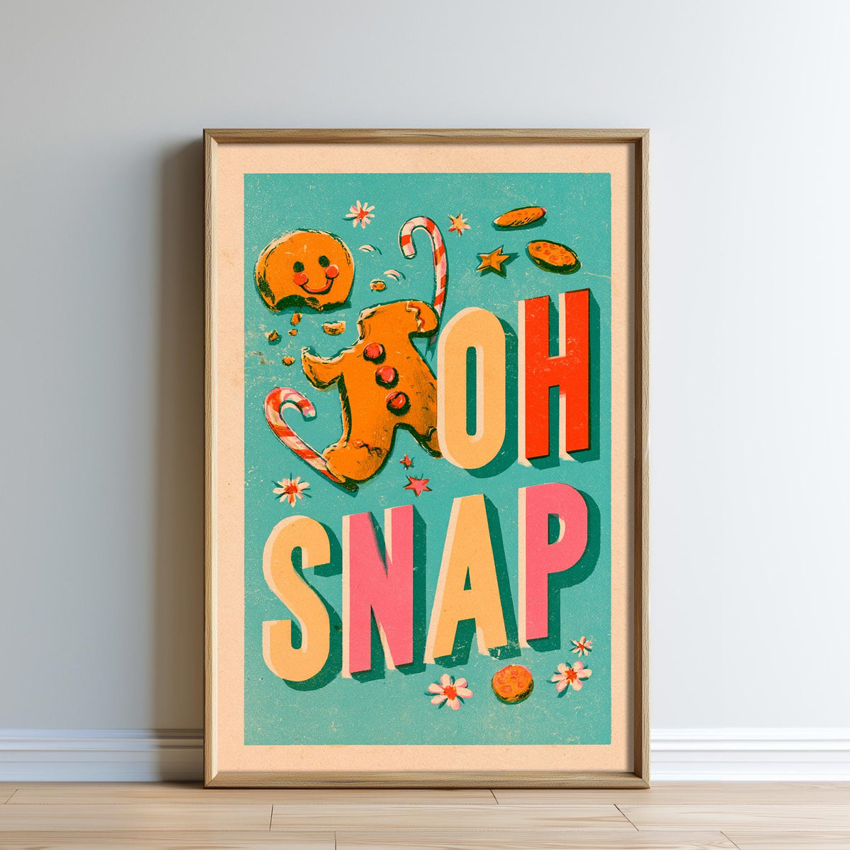 A framed poster with a gingerbread man and the text "OH SNAP" in a colorful, playful design.