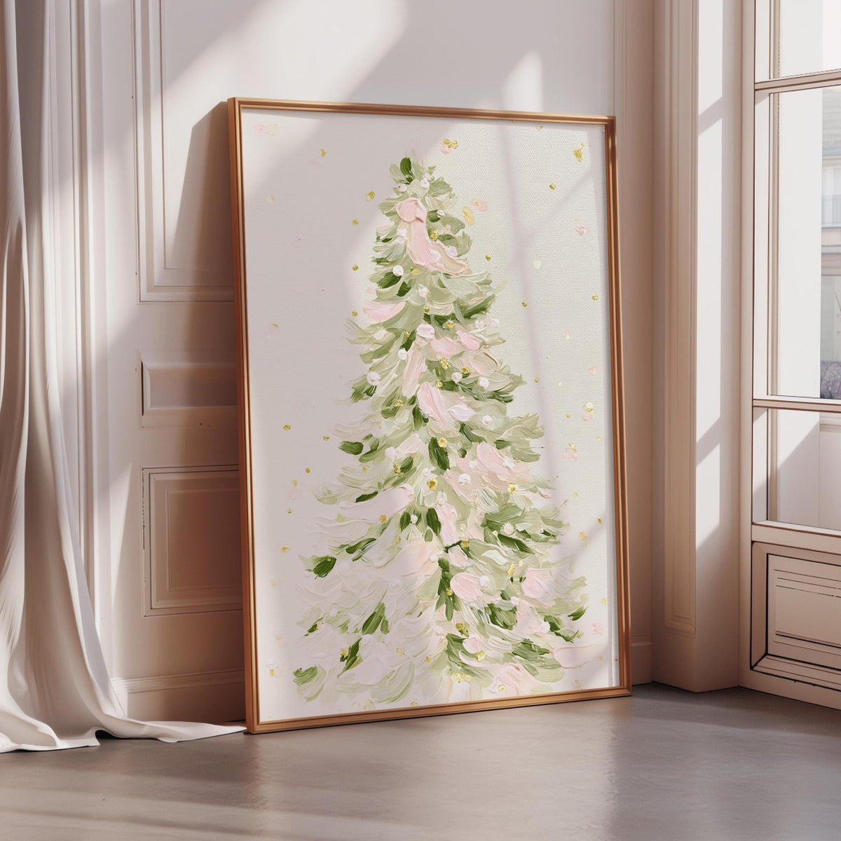 A large framed painting of a Christmas tree with green and pink leaves is displayed on a wall in a room with a window.