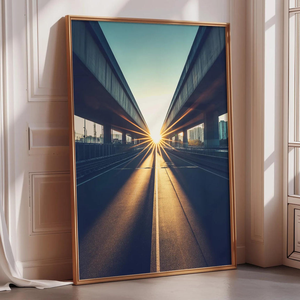a large framed picture of a cityscape with a sunburst effect, casting a warm glow on the buildings and creating a sense of depth and perspective.