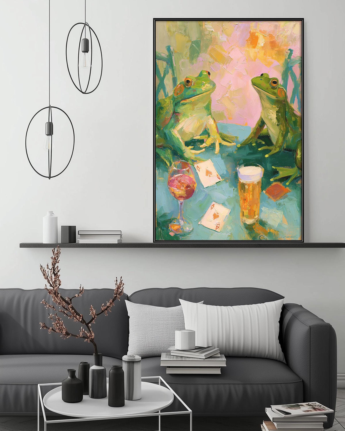a cozy living room with a gray sofa, a coffee table, and a large painting of two green frogs sitting at a table with a wine glass and playing cards. The painting is hanging on the wall above the sofa, creating a warm and inviting atmosphere.