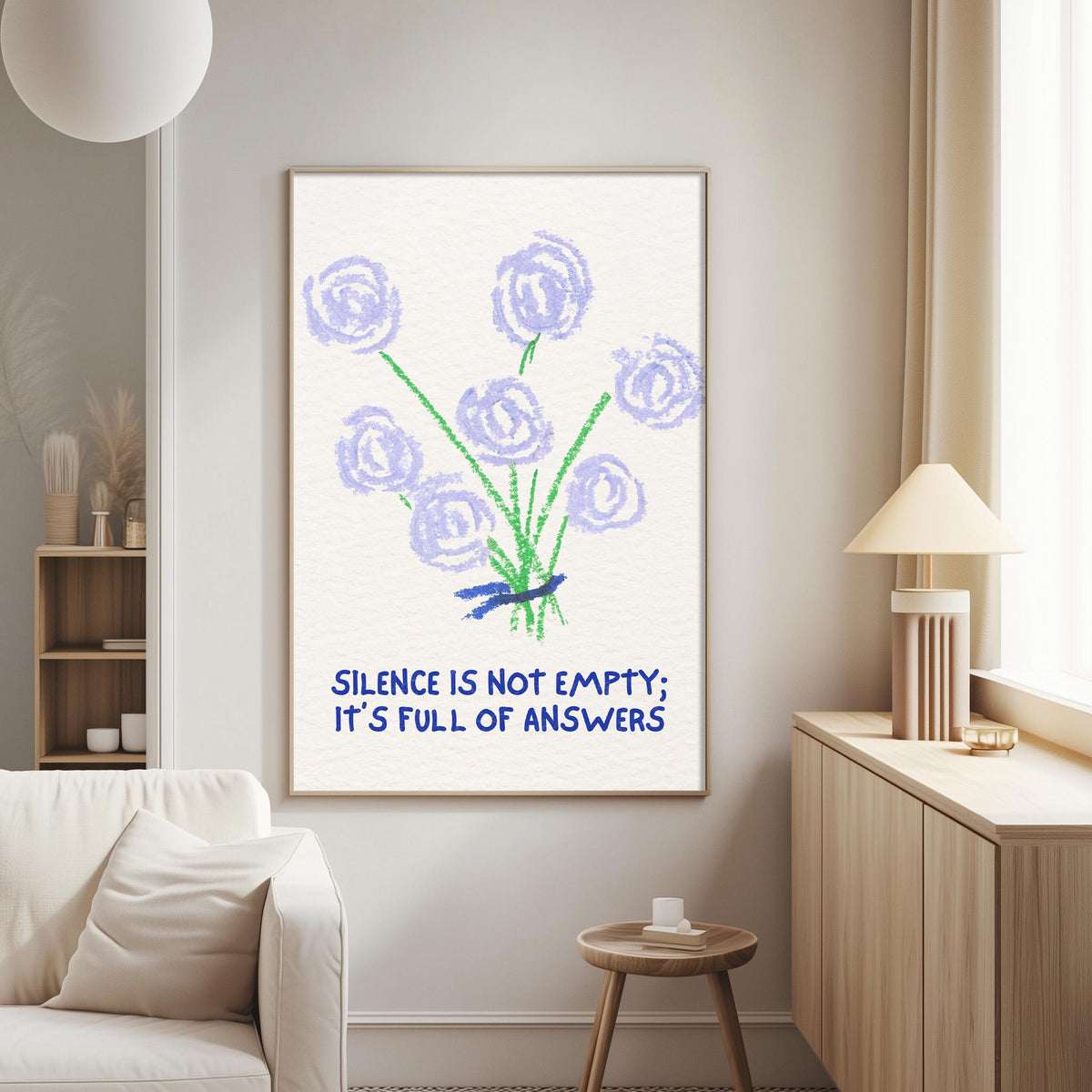 a poster with a floral design and the text "Silence is not empty; it's full of answers" hanging on a wall in a living room.