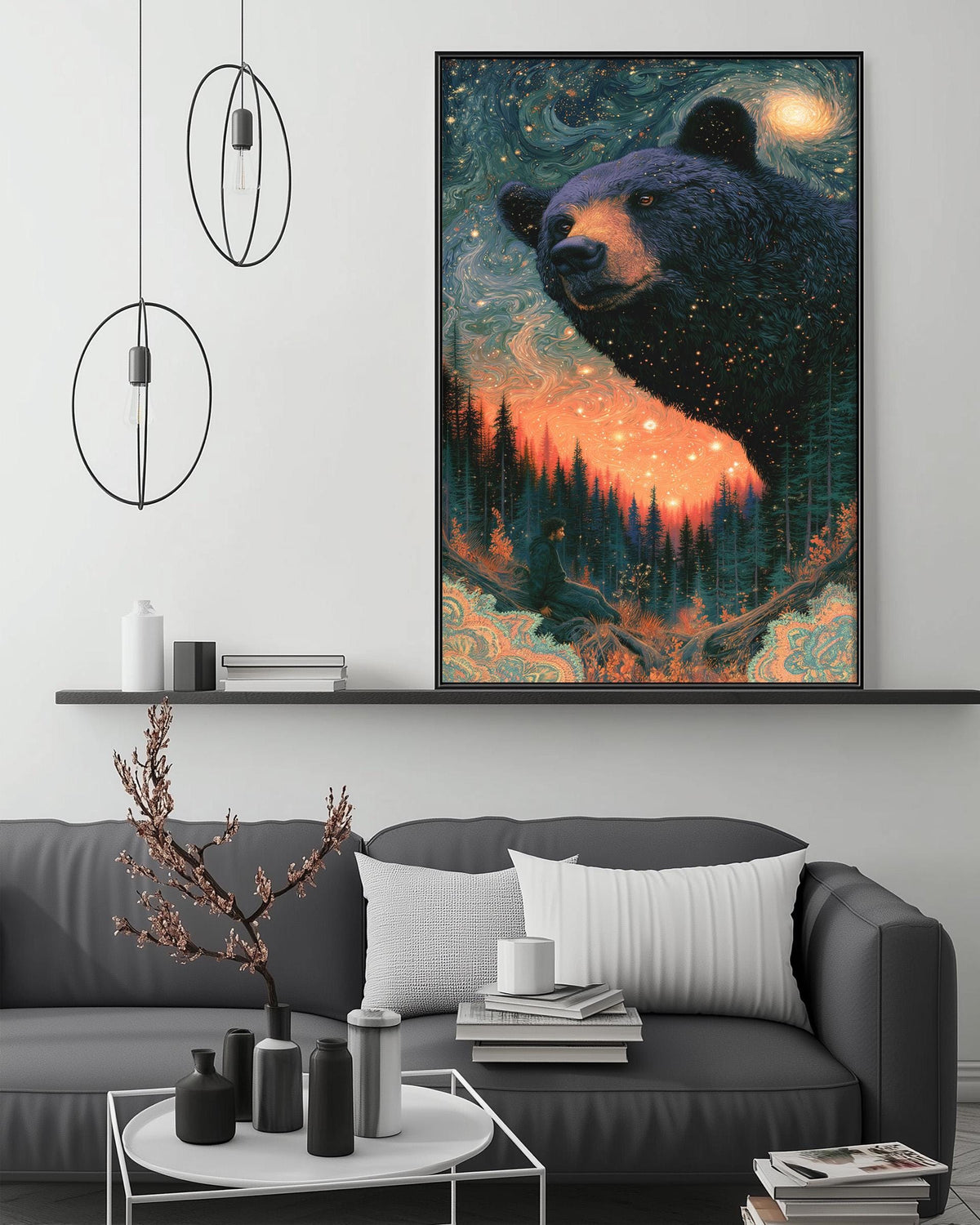 a large, colorful painting of a bear against a starry night sky, hanging on a wall above a gray couch with a coffee table in front of it.