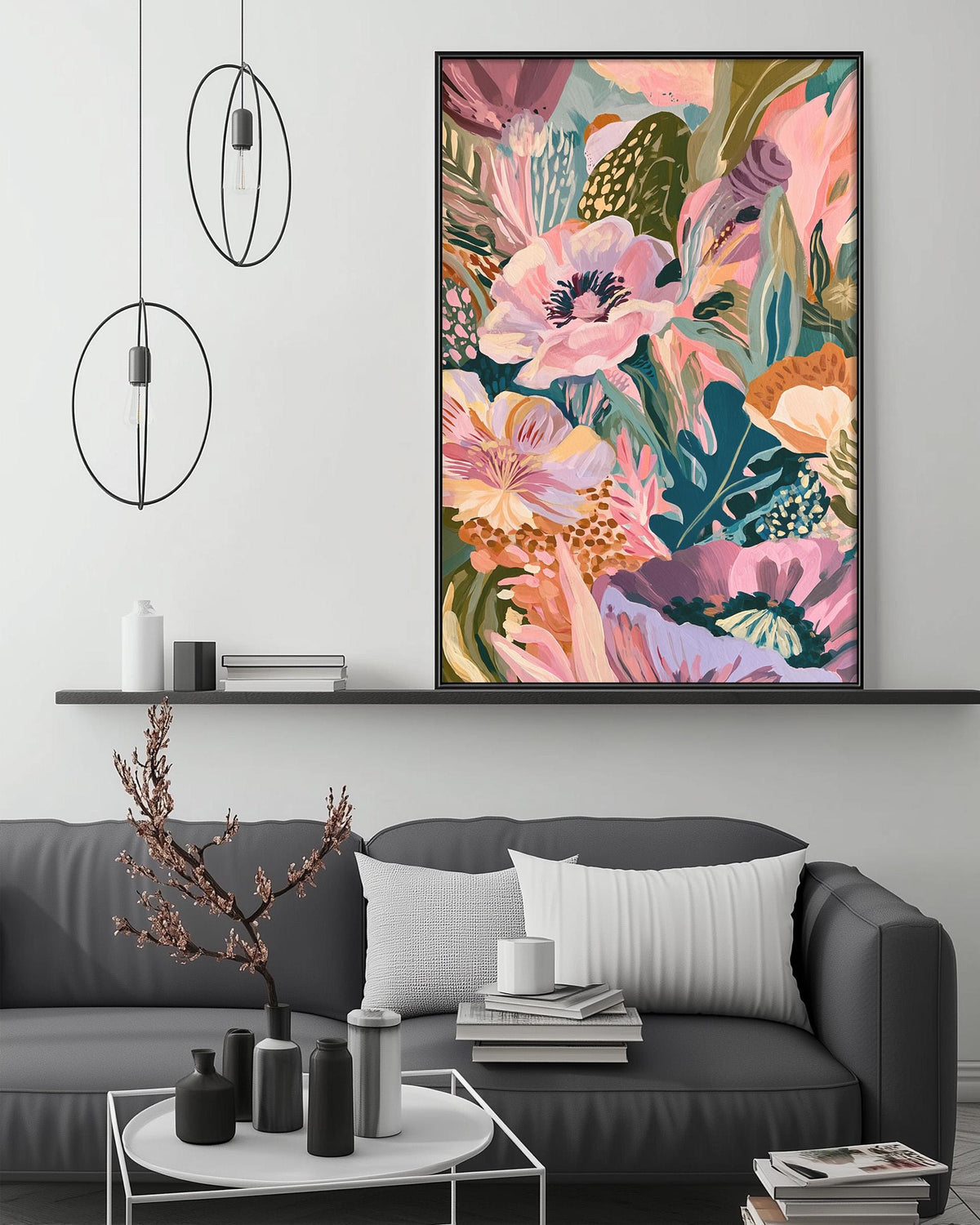 a modern living room with a gray sofa, a coffee table, and a large floral painting hanging on the wall above the sofa.