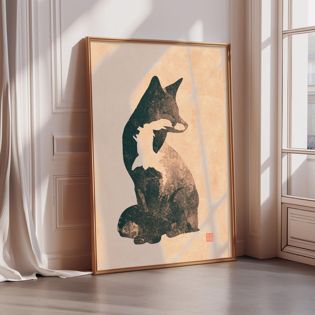 a framed artwork depicting a cat sitting on a wall.