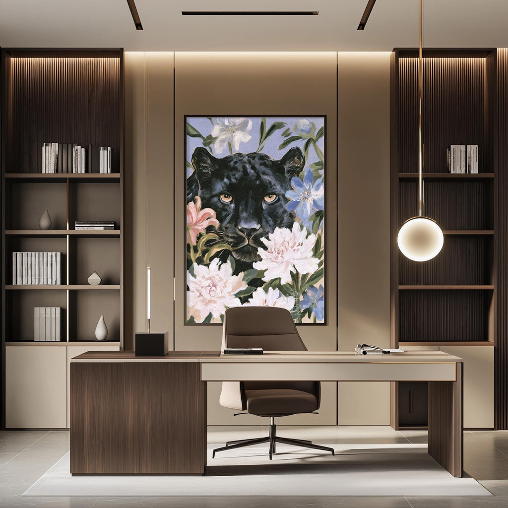 a modern and stylish office space with a large framed painting of a black panther surrounded by flowers on the wall. The office features a wooden desk, a comfortable chair, and a bookshelf filled with books and decorative items.