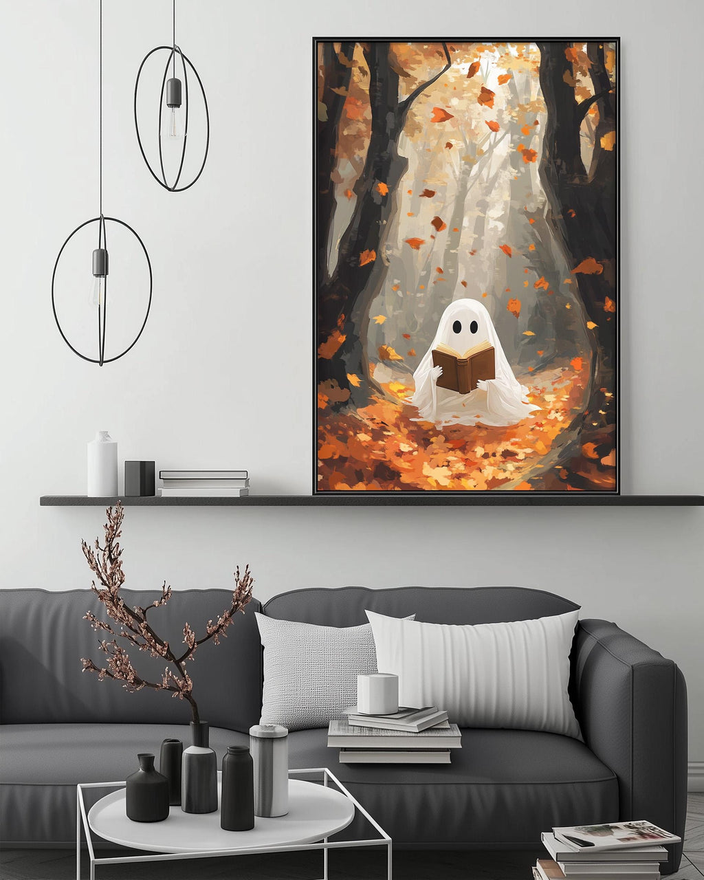 a cozy living room with a gray couch, a coffee table, and a large framed painting of a ghost reading a book in a forest setting.