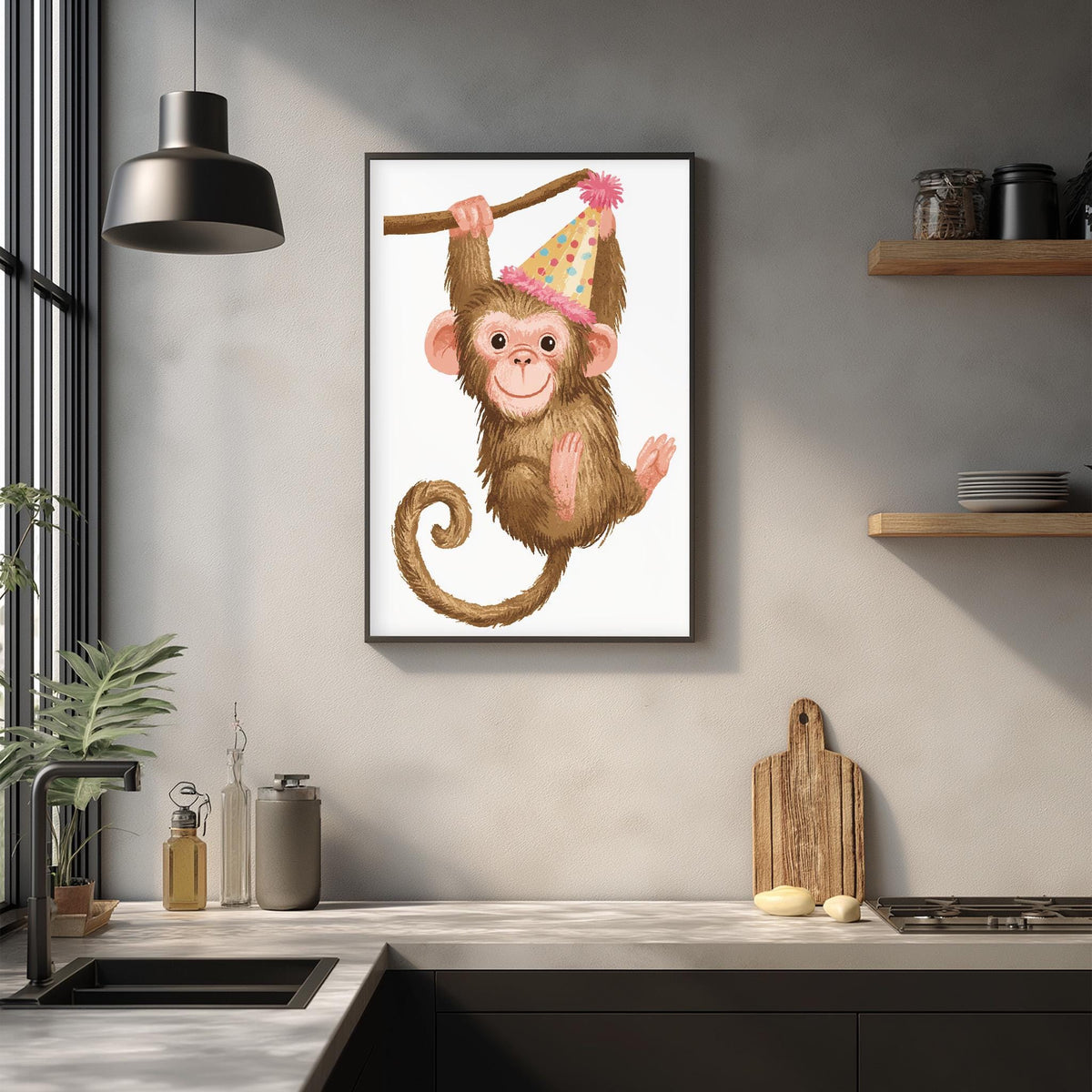 a framed illustration of a monkey wearing a party hat, hanging from a branch in a kitchen setting.