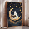 a framed painting depicting a ghost reading a book while sitting on a crescent moon.