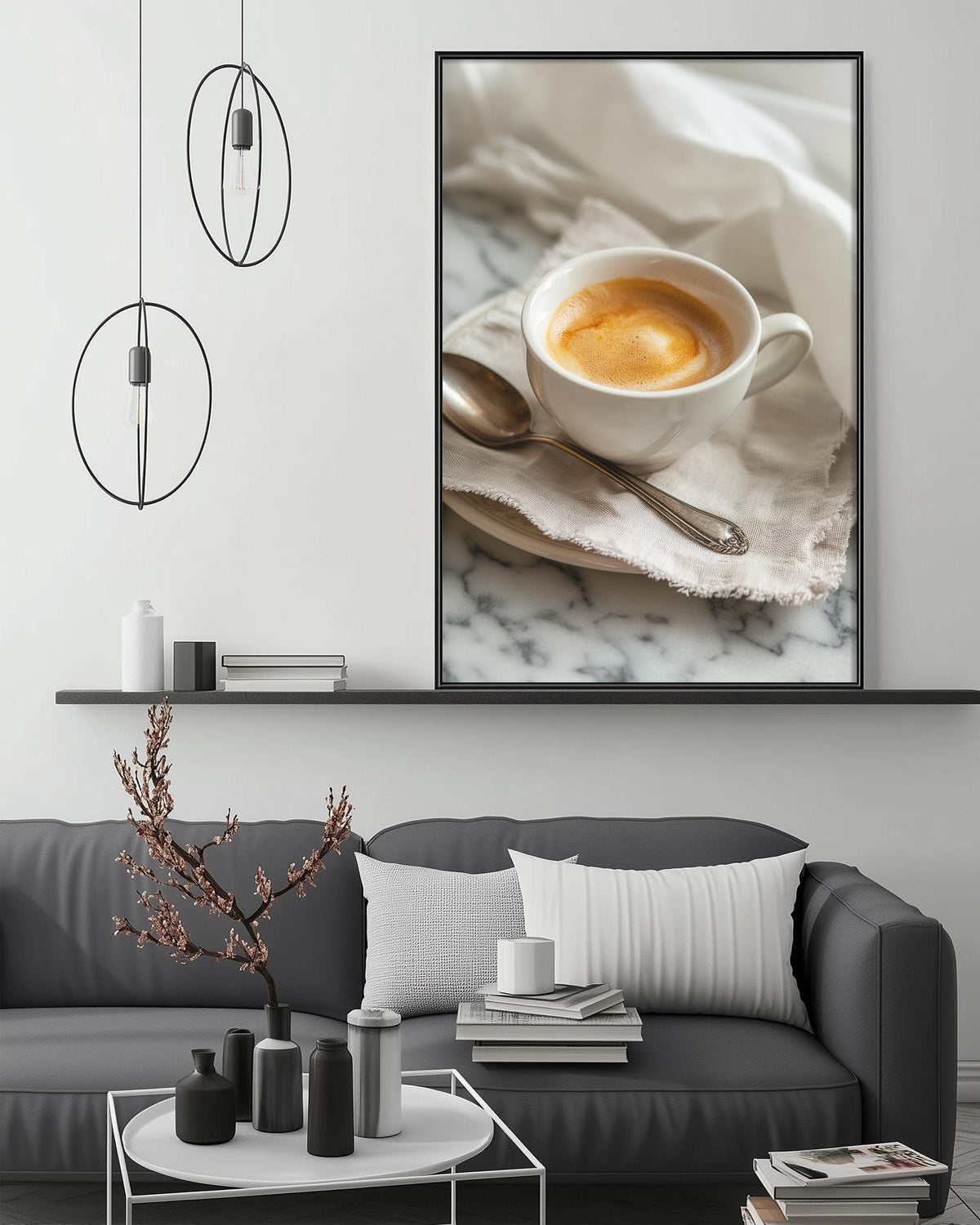 a cozy living room with a gray sofa, a coffee table with decorative items, and a framed photograph of a cup of coffee on a marble surface.