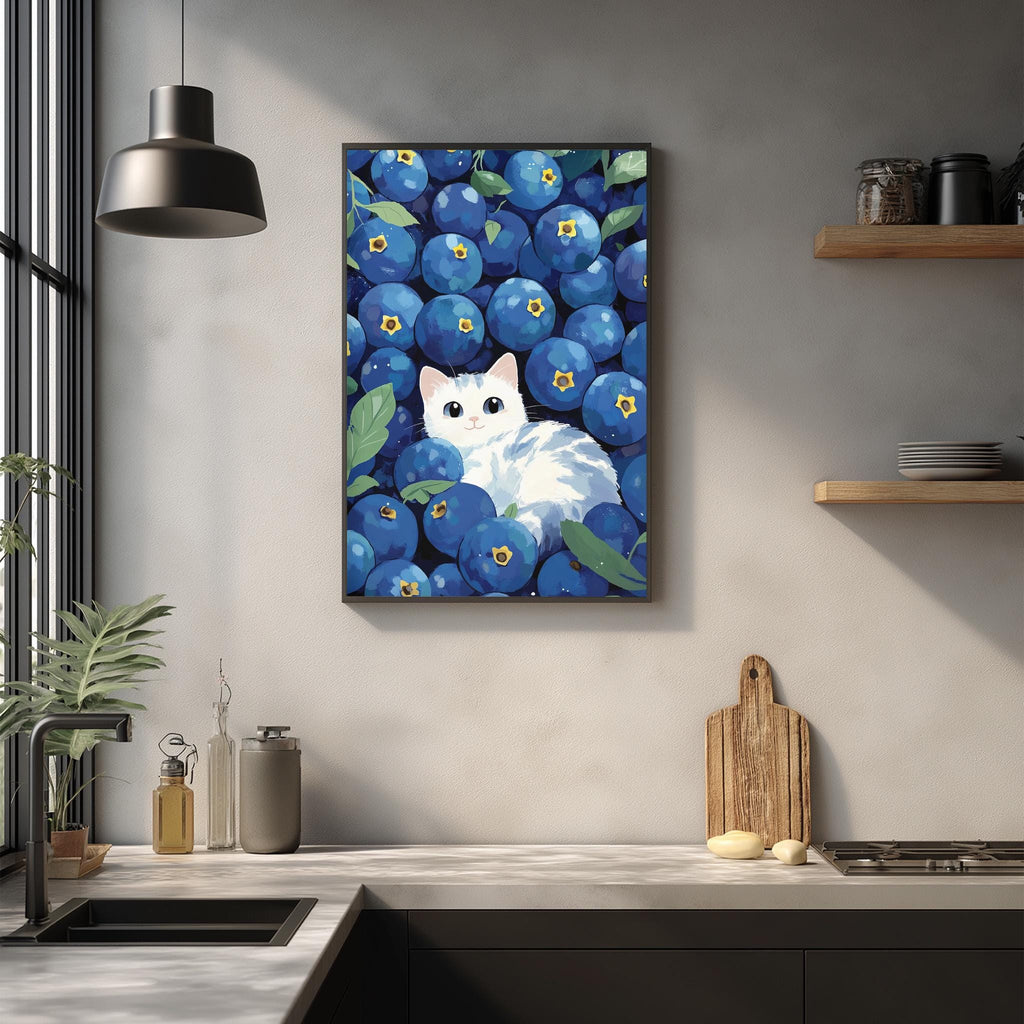 a kitchen counter with various items, including a framed painting of a cat surrounded by blueberries, a wooden cutting board, and a potted plant.