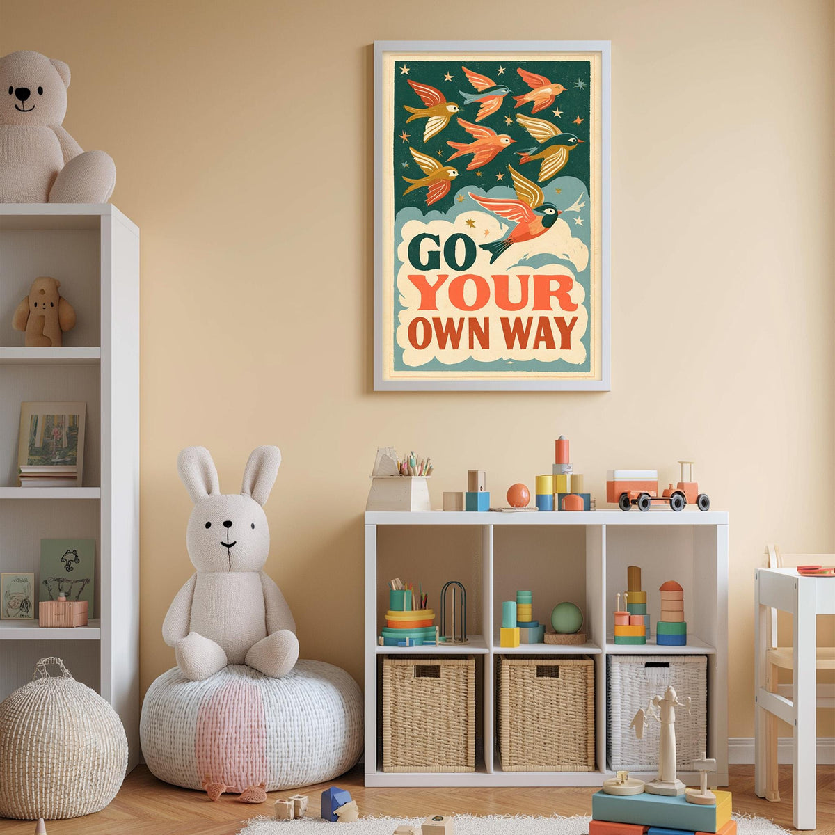 A child's bedroom with a white bookshelf, a stuffed rabbit, and a colorful poster on the wall. The poster features a bird illustration and the text "GO YOUR OWN WAY".