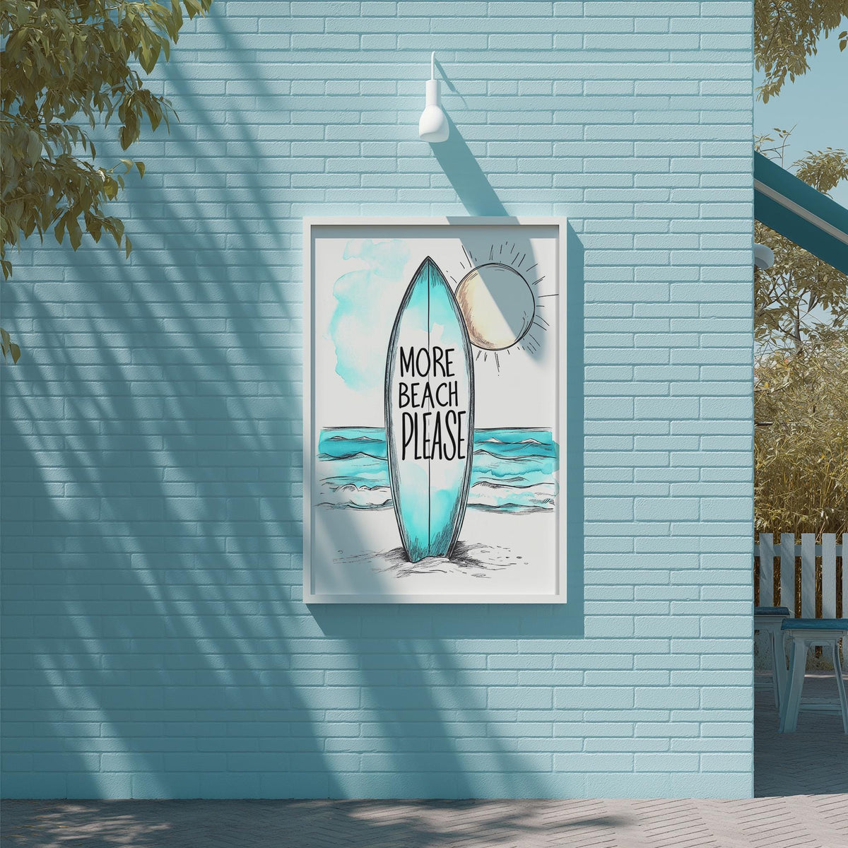 A framed poster with a surfboard and the text "MORE BEACH PLEASE" is displayed on a blue brick wall.
