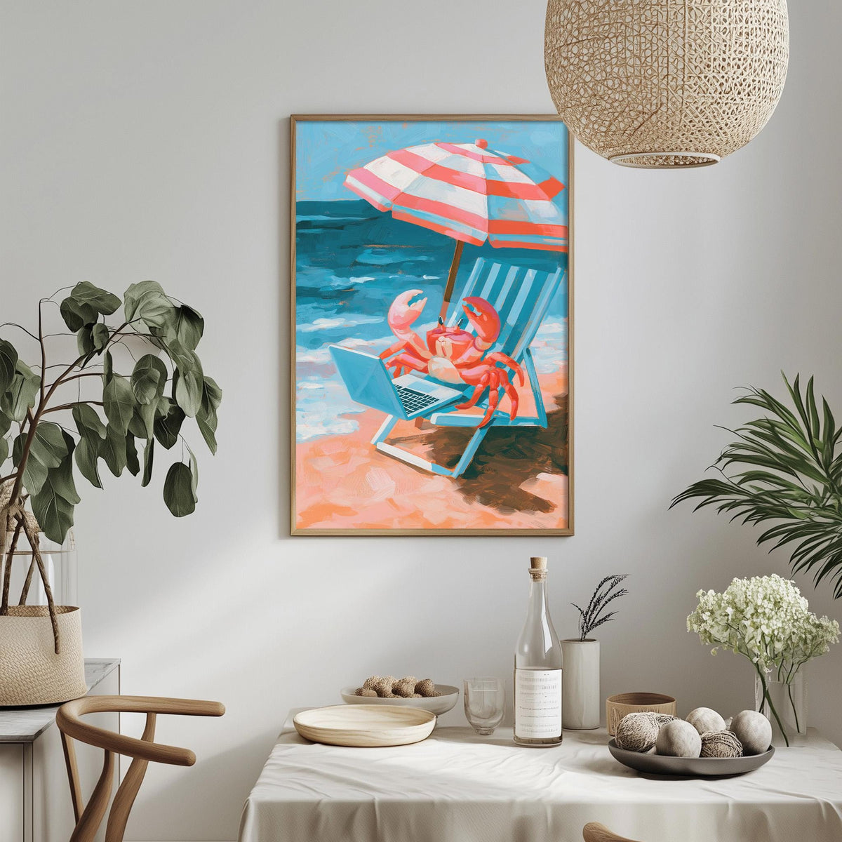 a framed painting of a crab sitting in a beach chair under an umbrella, with a beach scene in the background. The painting is hung on a wall above a dining table with various decorative items and plants.
