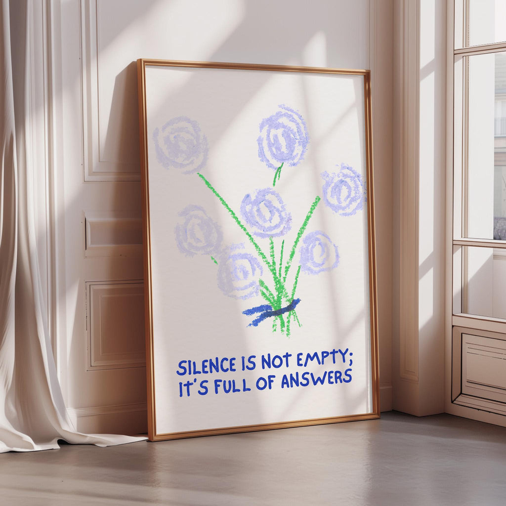 a framed poster with a drawing of blue flowers and the text "Silence is not empty; it's full of answers"