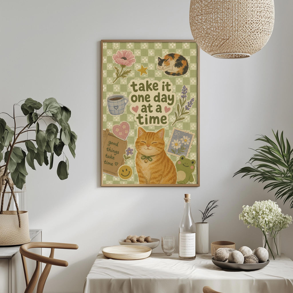 a framed poster with a cat illustration, surrounded by various decorative elements such as plants, flowers, and a bowl of fruit on a table.