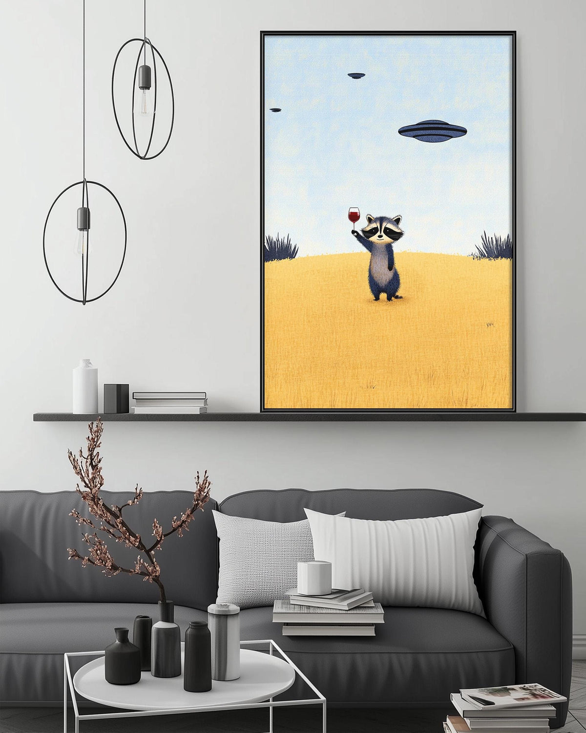a raccoon standing in a field with a yellow background, holding a red object in its paws. Above the raccoon, there is a framed image of a blue spaceship flying in the sky. The image is displayed on a wall above a gray couch, which has a coffee table in front of it. The room has a minimalist and modern design, with a black and white color scheme and a few decorative elements such as a potted plant and a vase.