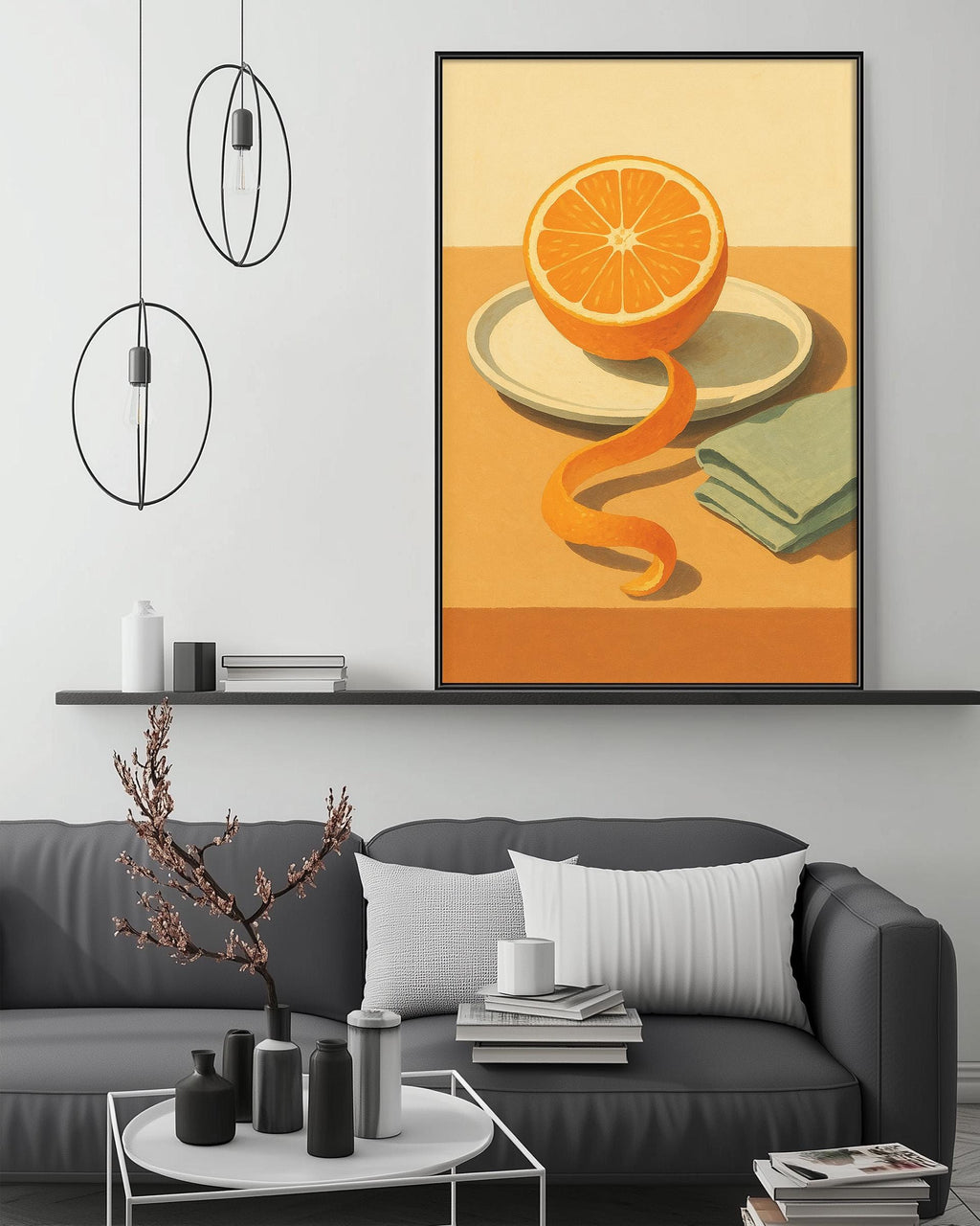 a modern living room with a gray sofa, a coffee table, and a large framed painting of an orange peel on a plate. The painting is hanging on the wall above the sofa, creating a focal point in the room.