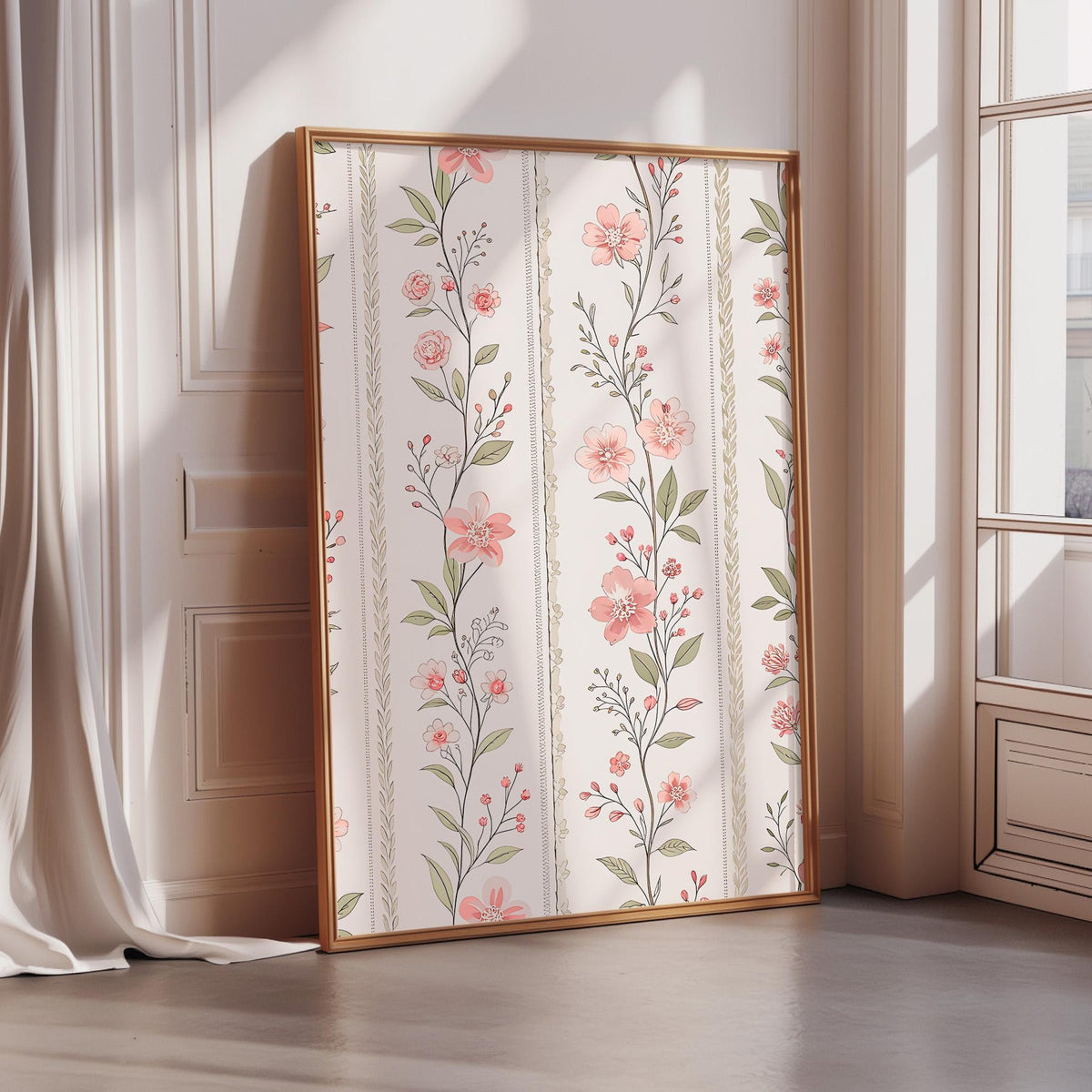 A framed print with a floral pattern is displayed on a wall in a room with a window.