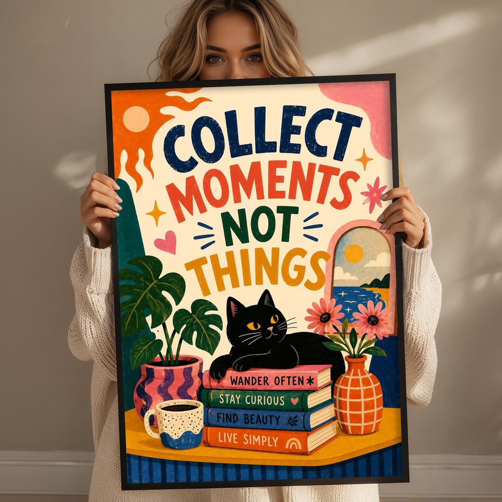 A woman is holding up a colorful poster with the text "Collect moments, not things" and various illustrations, including a cat, plants, and books.