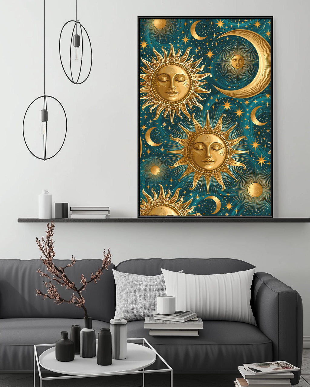 a large framed artwork depicting a night sky with suns, crescents, and stars, hanging above a gray couch in a living room setting.