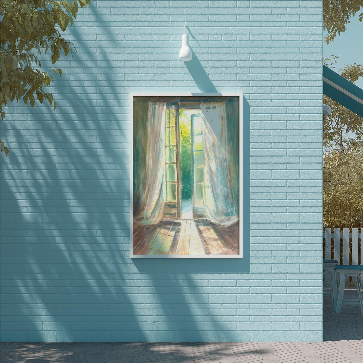 a blue brick wall with a framed painting of an open window, set against a backdrop of trees and a clear sky.