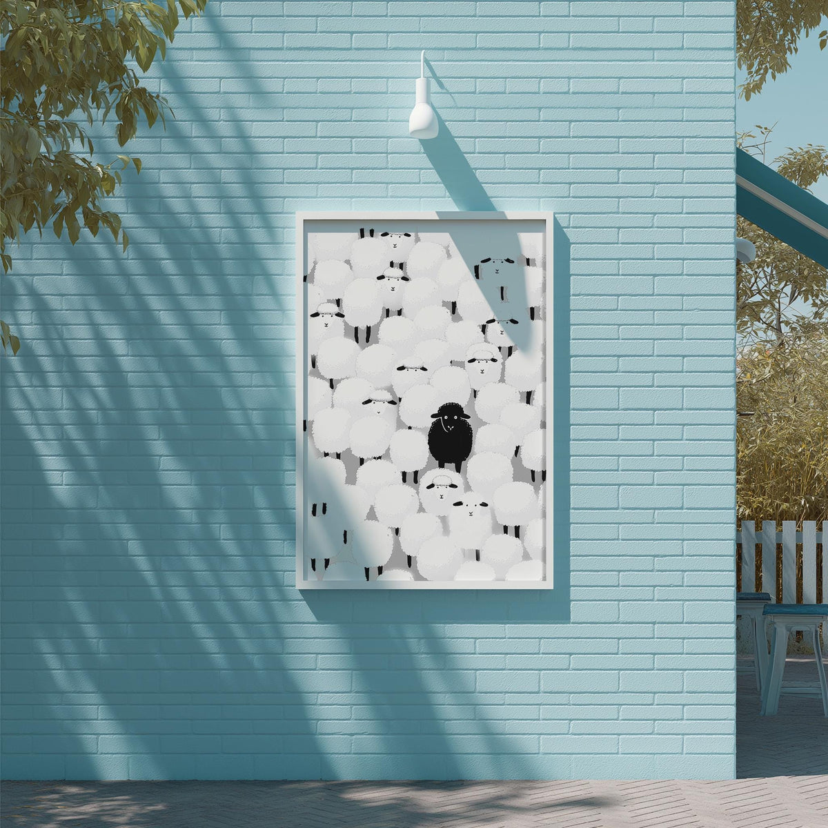 a blue brick wall with a framed artwork depicting a black bird surrounded by white circles.