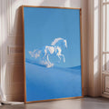 A large framed poster depicting a white horse galloping across a blue sandy landscape.