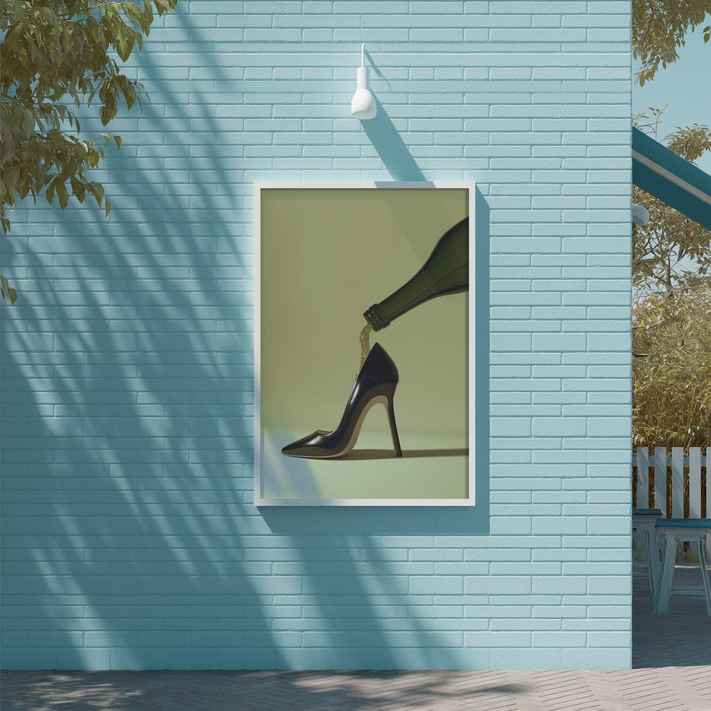 a framed artwork of a high-heeled shoe on a blue brick wall, with a white light fixture hanging above it.