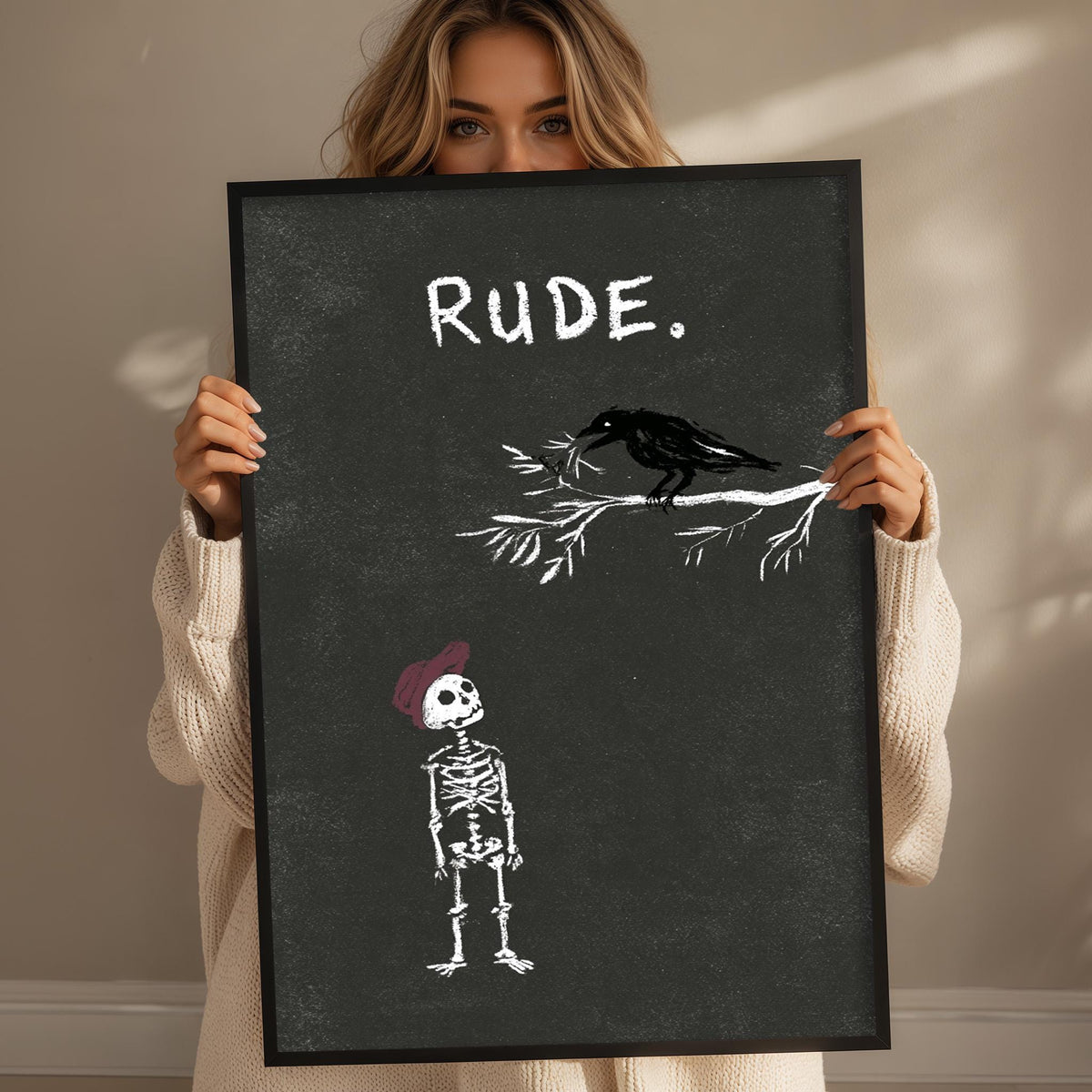 A woman holding a blackboard with a skeleton and a bird on it.
