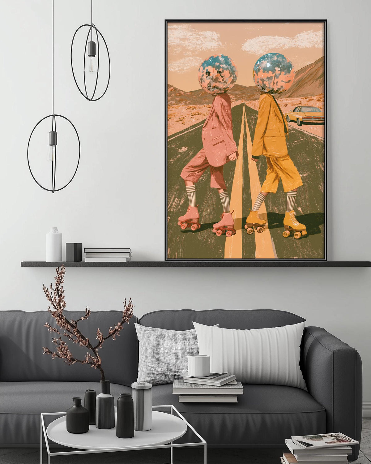 a modern art piece with two figures wearing roller skates, one in pink and the other in yellow, set against a colorful background. The artwork is displayed on a wall above a gray couch, which has a coffee table in front of it. The room also includes a shelf with decorative items and a potted plant.