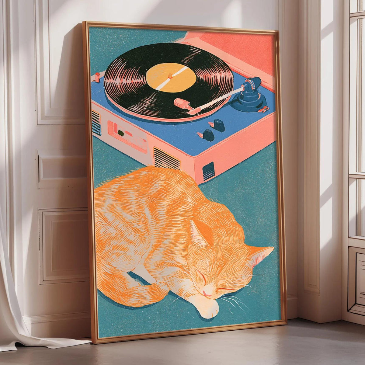 A framed illustration of an orange cat sleeping on a turquoise surface, with a record player and turquoise record player in the background.