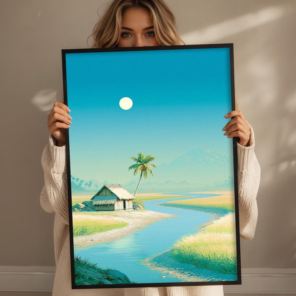 A woman holds up a framed painting depicting a serene landscape with a small hut, palm tree, and a winding river.