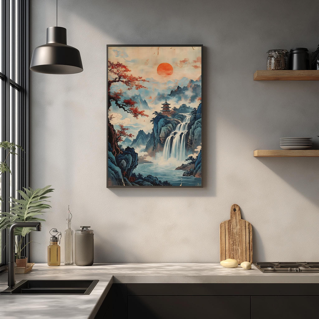 a kitchen counter with a framed painting of a waterfall and mountains hanging on the wall above it. The painting has a warm, orange and blue color scheme, creating a serene and picturesque scene. The kitchen counter also has various items, such as a cutting board, a bottle, and a vase, adding to the overall aesthetic of the space.