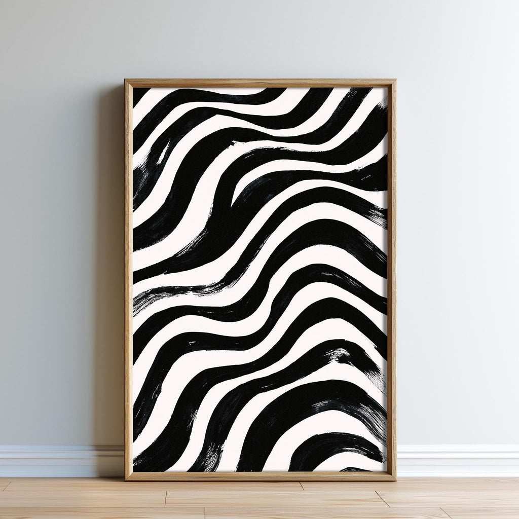 a large, framed print with a striking black and white abstract design.