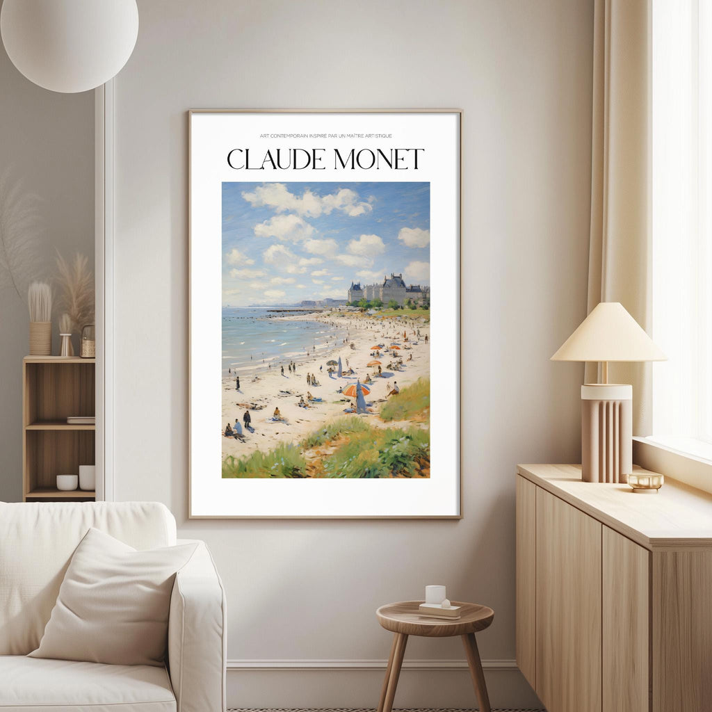 a framed painting of a beach scene with people and buildings in the background, hanging on a wall in a living room.
