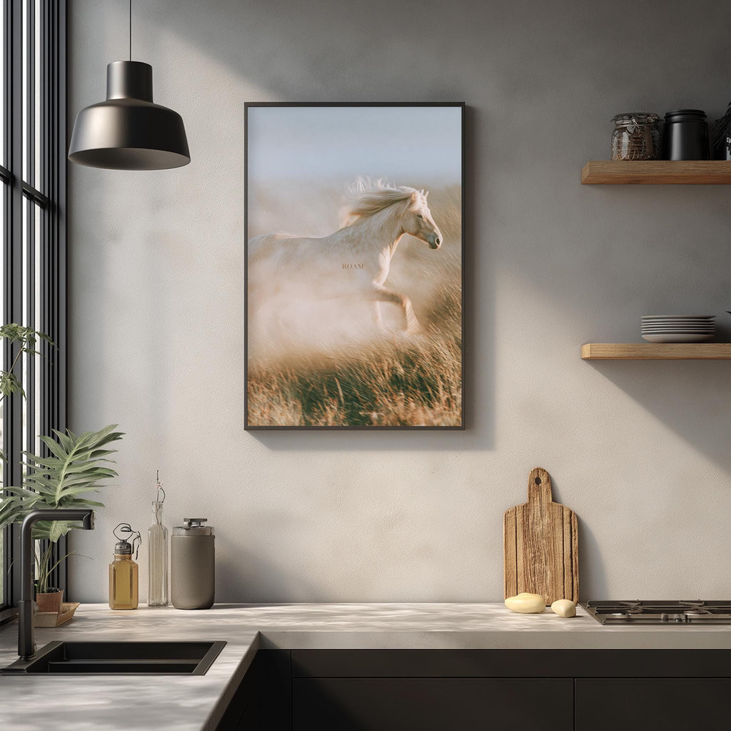 a kitchen counter with a framed picture of a horse running in a field, a wooden cutting board, and various kitchen items such as a bottle, a vase, and a bowl.