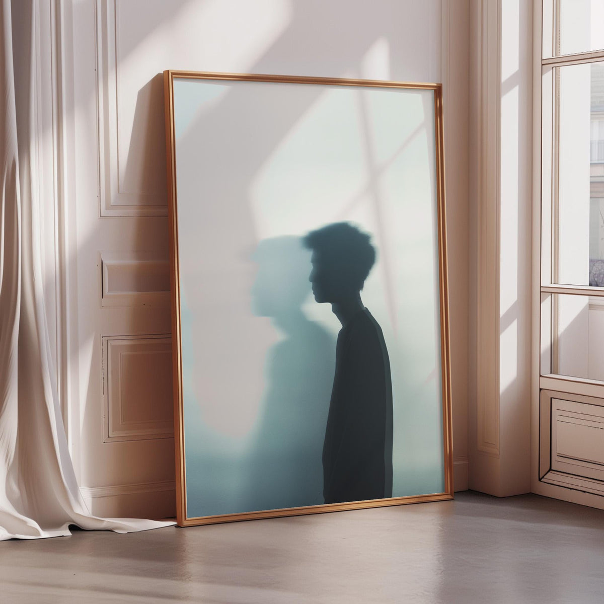 a large framed poster of a person's silhouette standing in a room with a window.