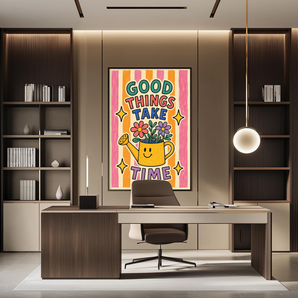 a modern office space with a large framed poster on the wall that says "GOOD THINGS TAKE TIME". The poster has a cheerful illustration of a watering can with flowers. The office has a wooden desk and chair, and there are bookshelves on either side of the desk.