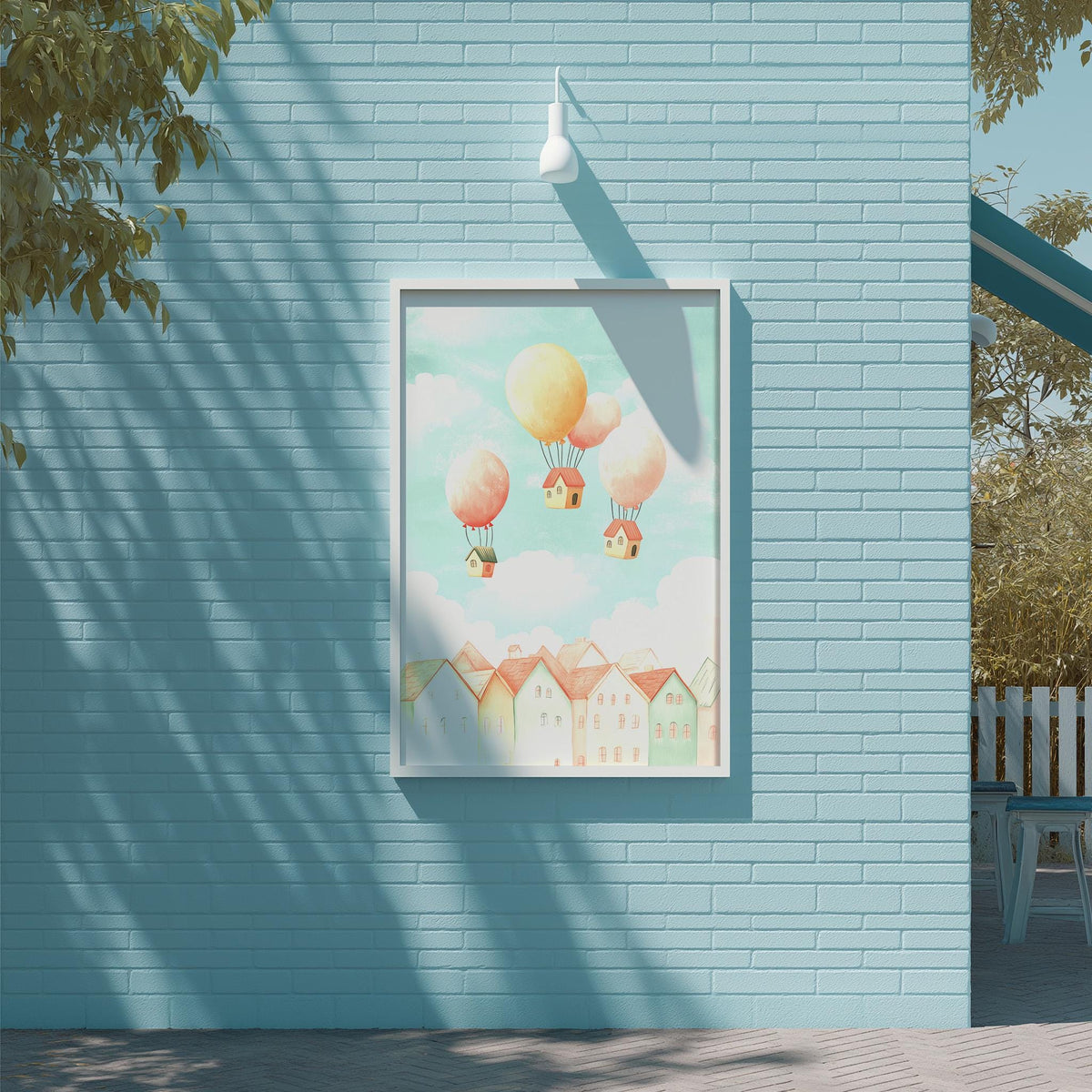 a blue brick wall with a framed illustration of houses and balloons floating in the sky above them.