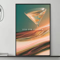 a modern living room with a gray sofa, a coffee table, and a large framed poster of a cocktail glass on the wall.