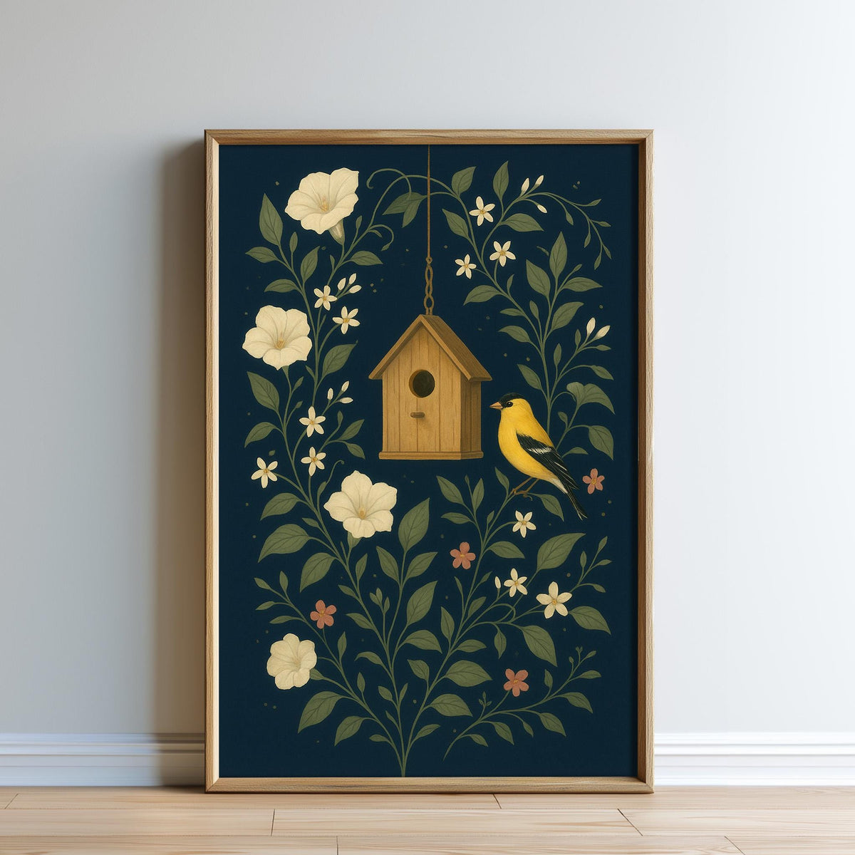 A framed print depicting a birdhouse surrounded by flowers and leaves, with a yellow bird perched on the roof.