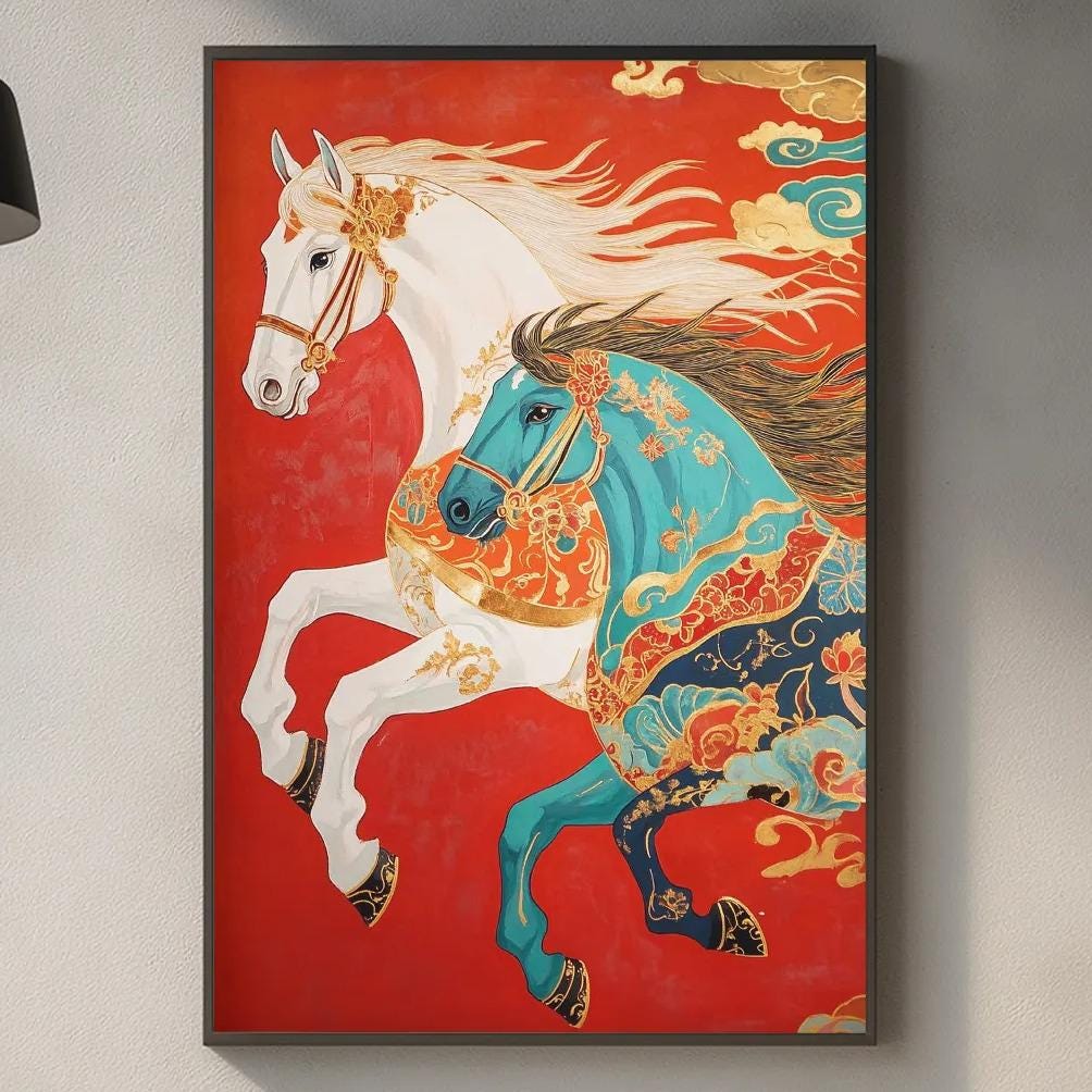 a vibrant painting of two horses, one white and one blue, against a red background. The painting is hanging on a wall above a kitchen counter, which has various kitchen items such as a cutting board, a bottle, and a vase.