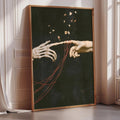 a large framed artwork depicting two skeletal hands reaching towards each other, with red strings connecting them.