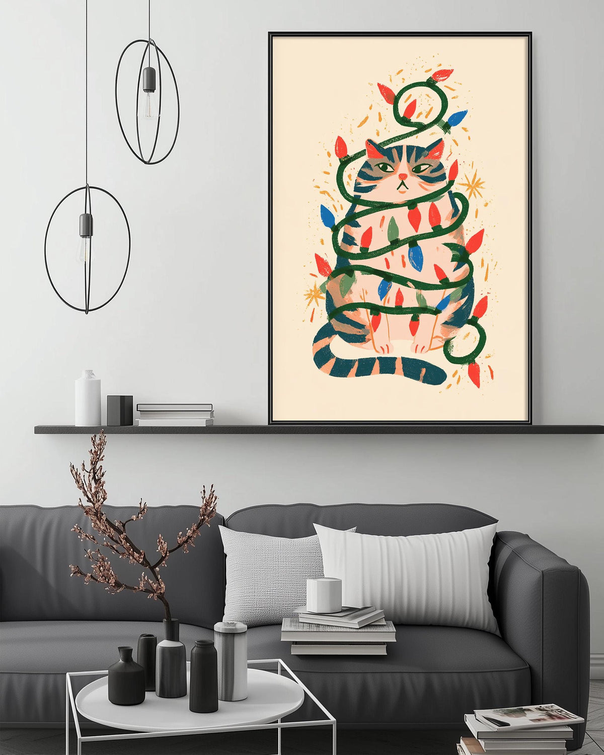 a cozy living room with a gray sofa, a coffee table, and a framed illustration of a cat wrapped in colorful lights. The room has a minimalist and modern design, with a white wall and a shelf displaying decorative items.