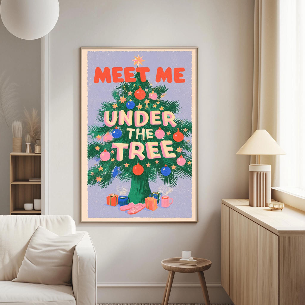 a large, colorful poster of a Christmas tree with the text "MEET ME UNDER THE TREE" written on it. The poster is hanging on a wall in a living room setting, with a white couch and a small table nearby.