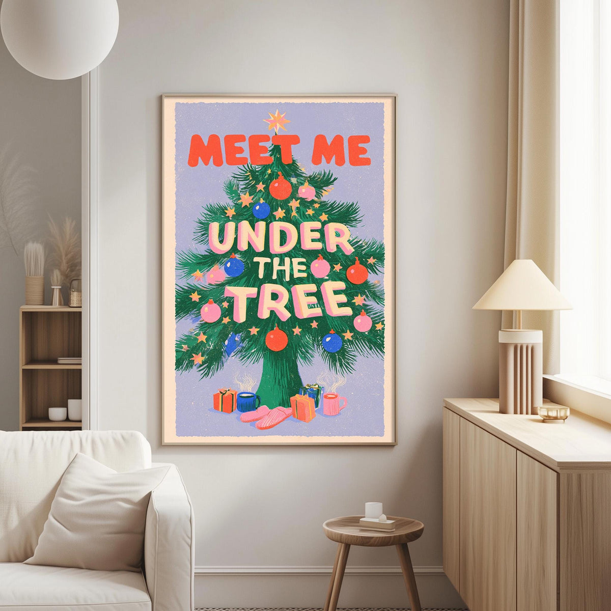a large, colorful poster of a Christmas tree with the text "MEET ME UNDER THE TREE" written on it. The poster is hanging on a wall in a living room setting, with a white couch and a small table nearby.