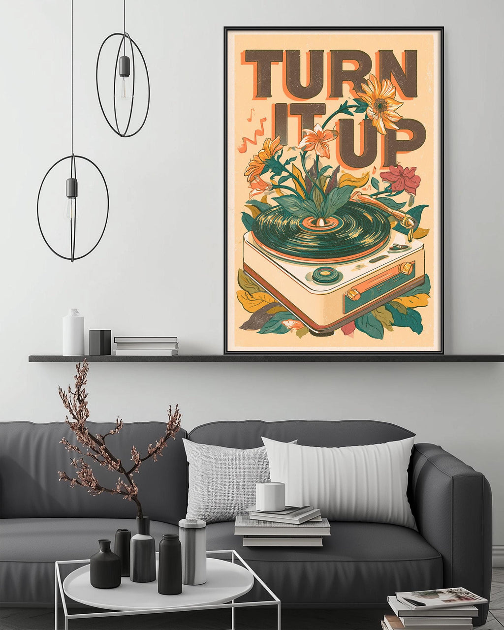 a poster with a record player and flowers on a wall, along with a gray couch, a coffee table, and some decorative items.