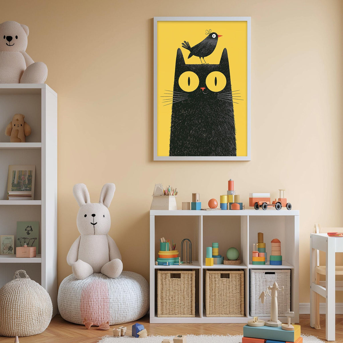 A child's bedroom with a white bookshelf, a stuffed rabbit, a stuffed cat, and a colorful toy box filled with toys. A framed picture of a cat with a bird on its head is hanging on the wall above the bookshelf.
